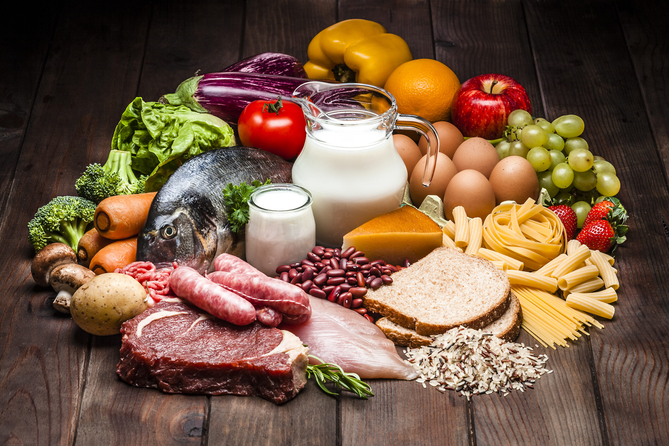 Different types of food on rustic wooden table